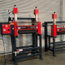 Industrial Laminator Walco 830 - side-by-side installation of multiple red laminating units in a factory setting.