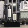 Laminatrice verticale industriale VX2 di Walco - dettaglio delle doppie teste di applicazione con pellicola protettiva bianca